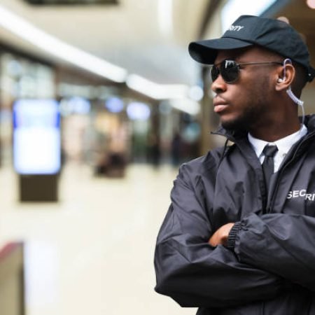 Security Guard Officer Standing In Shopping Mall